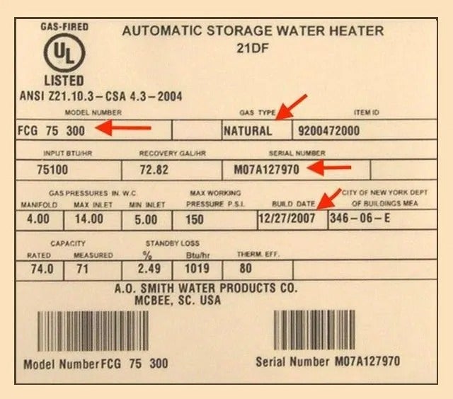 A white water heater label with gas type, model number, serial number, and build date highlighted by red arrows.